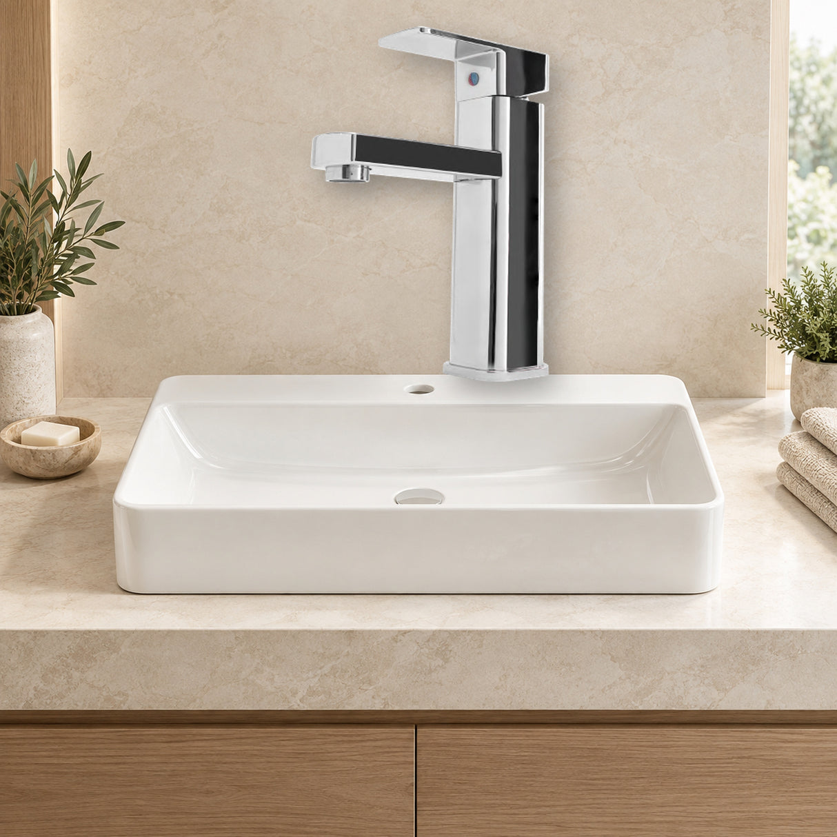 Mezclador para lavamanos en acero inoxidable 201 cromado instalado en baño claro