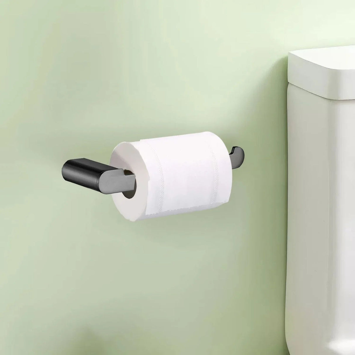 Portarrollos Kassel gunmetal instalado junto al sanitario