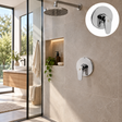 Registro monocontrol para ducha en ABS cromado con escudo redondo instalado en baño moderno