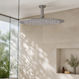 Cabezal de Ducha Circular de 10 Pulgadas en Acero Inoxidable instalado en un ambiente moderno y bien iluminado
