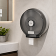 Dispensador Industrial de Papel Higiénico Acrílico con Llave instalado en un ambiente moderno y bien iluminado