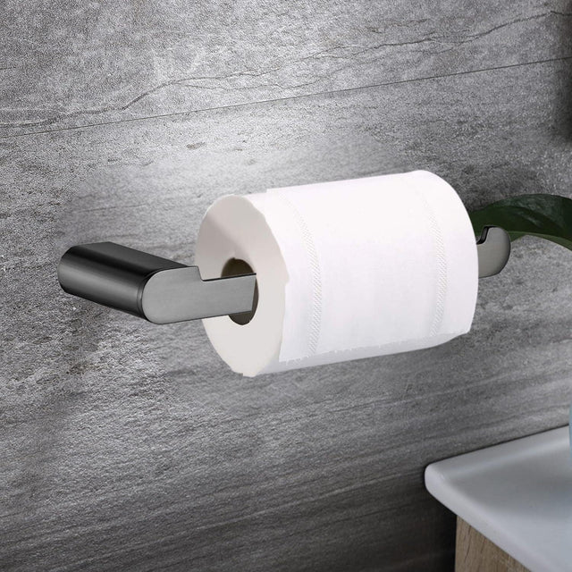 Portarrollos Kassel gunmetal instalado en baño de pared gris