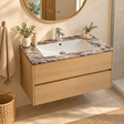 Lavamanos integrado policolor en un baño con mueble; grifería y mueble de ambientación no incluidos
