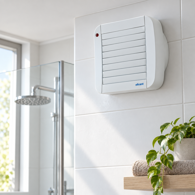 Extractor ECO 100 A instalado en baño, carcasa rectangular con persiana automática
