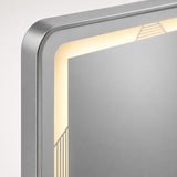 Detalle del marco de aluminio satinado y la iluminación LED integrada del espejo