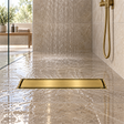 Rejilla invisible Oro cepillado instalada en ducha